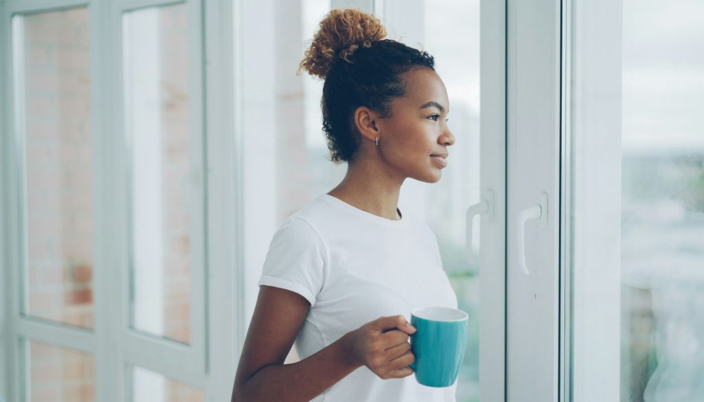Well-rested woman holding a coffee cup
